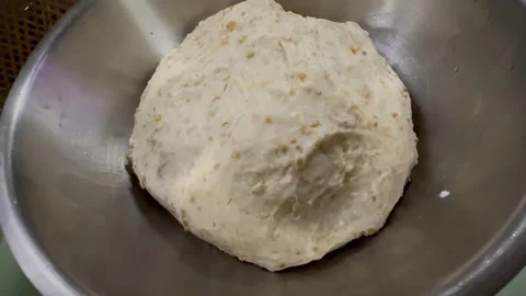 Circle Bread dough after kneading put  in mixed bowl for proofing Stock Footage 340304699