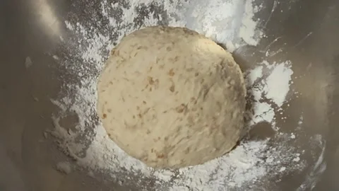 Circle Bread dough after kneading put  in mixed bowl for proofing Stock Footage 340304704