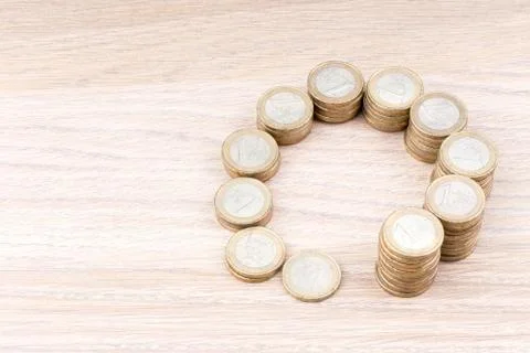 Circle of coins increasing in size Stock Photos