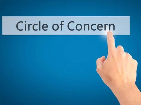 Circle of Concern - Hand pressing a button on blurred background concept on v Stock Photos