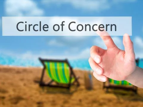 Circle of Concern - Hand pressing a button on blurred background concept on v Stock Photos