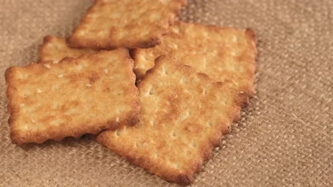 Circle crackers with salt. Close up. Rotating cracker cookies background. Tasty Video stock 170871175