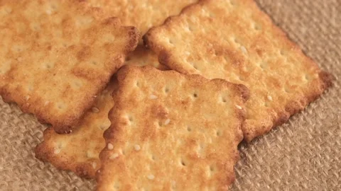 Circle crackers with salt. Close up. Rotating cracker cookies background. Tasty Stock Footage 171236421