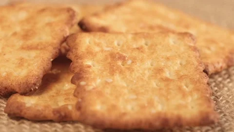 Circle crackers with salt. Close up. Rotating cracker cookies background. Tasty Stock Footage 171846880