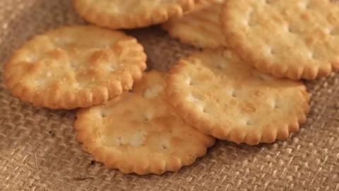 Circle crackers with salt. Close up. Rotating cracker cookies background. Tasty Stock Footage 171846971