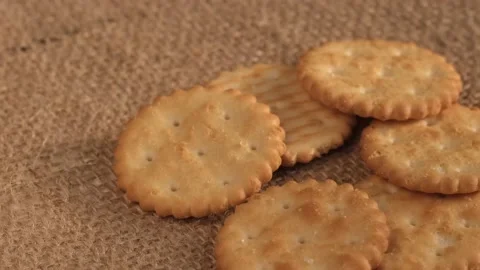 Circle crackers with salt. Close up. Rotating cracker cookies background. Tasty Stock Footage 172334587