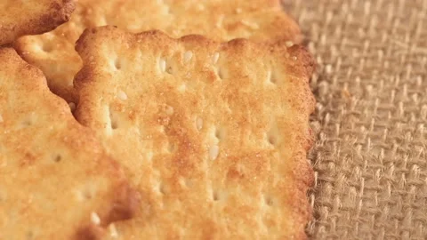 Circle crackers with salt. Close up. Rotating cracker cookies background. Tasty Stock Footage 172359504