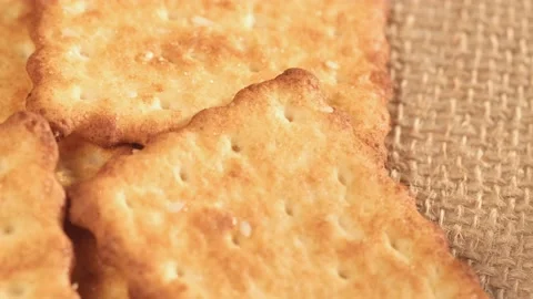 Circle crackers with salt. Close up. Rotating cracker cookies background. Tasty Video stock 172559512