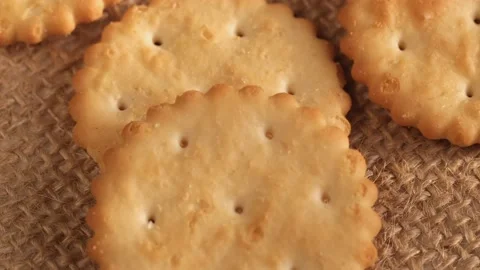Circle crackers with salt. Close up. Rotating cracker cookies background. Tasty Stock Footage 172955719