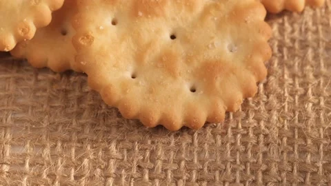 Circle crackers with salt. Close up. Rotating cracker cookies background. Tasty Stock Footage 175223651