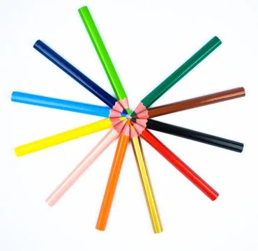 A circle design made with some different colored wood pencil crayons on white Stock Photos