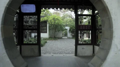 Circle doorway with Chinese script on wall at Buddhist temple - Suzhou, China Stock Footage 149664068