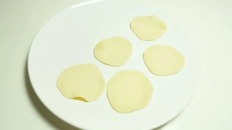 Circle dough appear on white ceramic plate Stock Footage 63780863