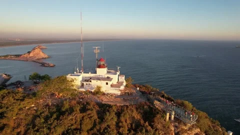 Circle drone footage at sunset of the lighthouse in Mazatlan, Mexico. Stock Footage 172508532