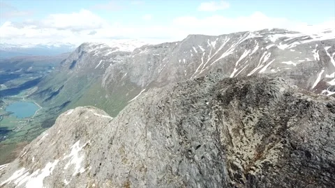 Circle drone shot of mountain peak in Norway Stock Footage 157697058
