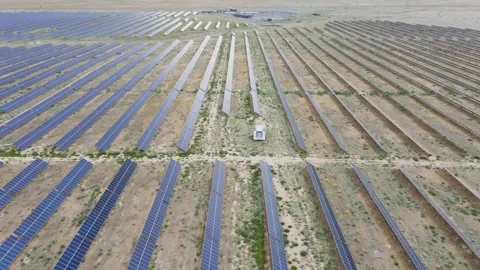 Circle flight of a drone over a modern field of alternative energy Stock Footage 135502415