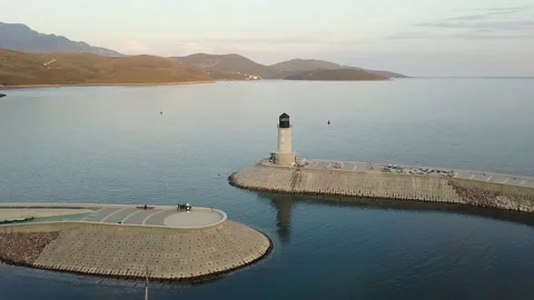 Circle flight view of the breakwaters in Montenegro Stock Footage 208089028