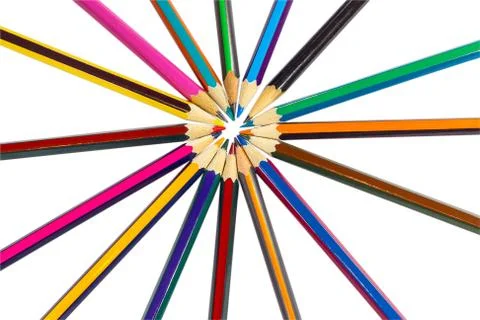 The circle is lined with colored pencils like rays of the sun Stock Photos