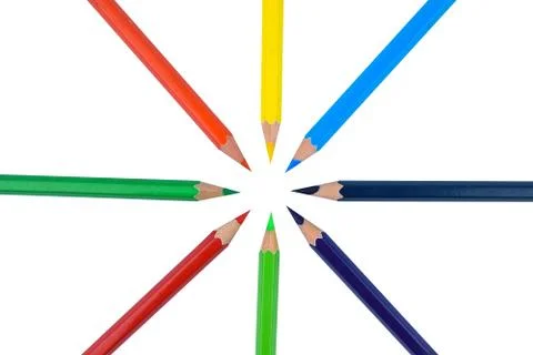 A circle made with eight different colored wood pencil crayon arranged before Stock Photos
