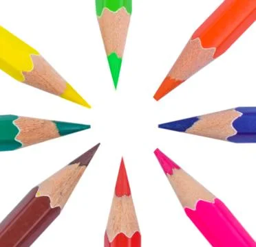 Circle made with eight different colored wood pencil crayons on a paper Stock Photos