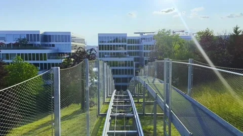 The Circle Outdoor Cable Elevator and a Modern Hotel, Standseilbahn Butzenbueel Stock Footage 317345532