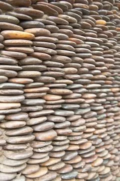 Circle pebble wall,abstract background Stock Photos