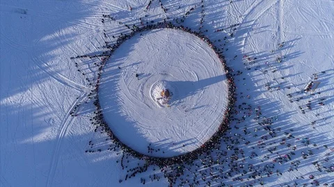 Circle of people which watch burning of dummy during celebration of Russian Stock Footage 87773215