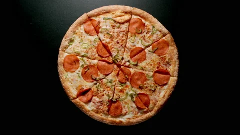 Circle Of Pizza Is Rotating On A Black Table Stock Footage 147109398