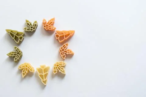 Circle with raw pasta. Tree and leaves shaped Stock Photos