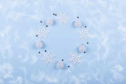 Circle round frame of Christmas decorations and snowflake on pastel blue Stock Photos