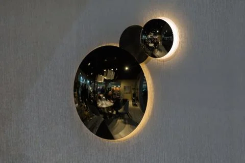 Circle shape three wall chandeliers lamps. A chandelier on the wall with a ro Stock Photos