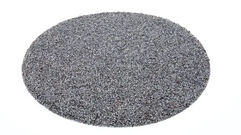 Circle shaped heap of organic raw poppy seeds rotating. Angled view.  Stock Footage 88096236