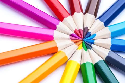 A circle of sharpened colored pencils on a white background. Stock Photos