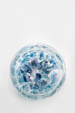 A circle of soap bubbles from blue shower gel on a white background. Stock Photos
