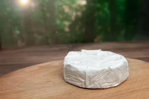 A circle of soft brie cheese with white mold from cow's milk Stock Photos