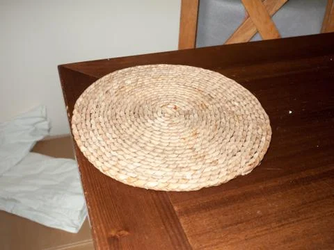 A circle spiral straw table top mat Stock Photos