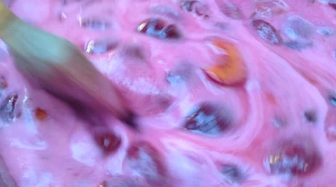 Circle stirring with a spoon of Red plum jam Stock Footage 58299317