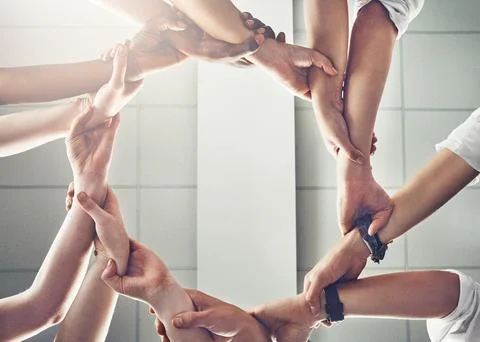 Circle, teamwork and hands together for group synergy, collaboration and problem Stockfoto's