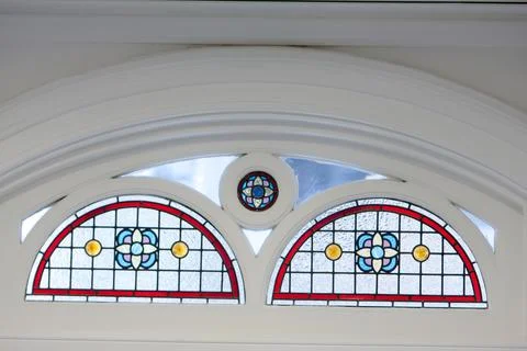 Circle top shaped window with elegant patterned stained glass. 13 Jan 2008 Stock Photos