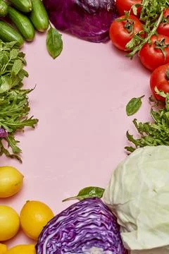 A circle of vegetables including lettuce tomatoes and other vegetables Stock Photos