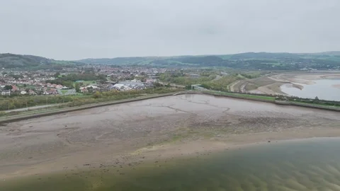 Circle view over River Convy and Conwy Castle from a drone, Convy, North Wales Stock Footage 319964893