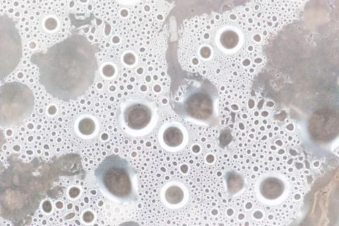 Circle water drops macro from under the plastic material. Stock Photos