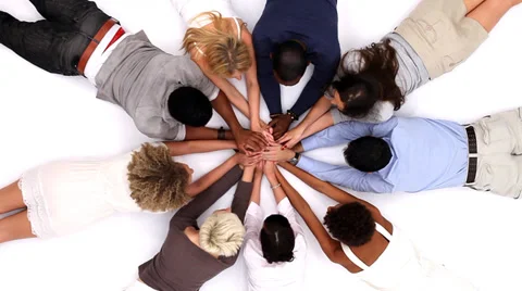 Circle of young people in white studio shot from above. Stock-Footage 32959641