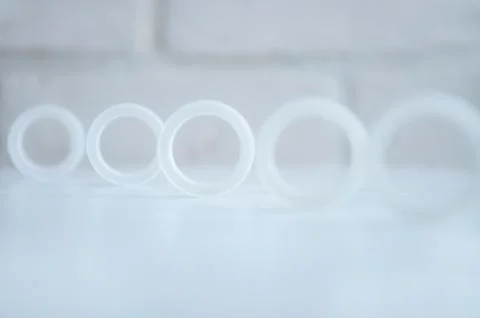 Circles on a bokeh effect loft background. Rings set in a row. Stock Photos