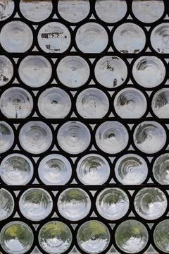 Circles of convex glass in window create interesting background element Stock Photos