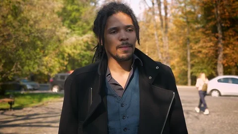 Circling around close-up view of of young African-American guy with dreadlocks Video stock 99460203