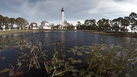 Circling around a land-based lighthouse in 25 percent slow motion. Stock Footage 90562640