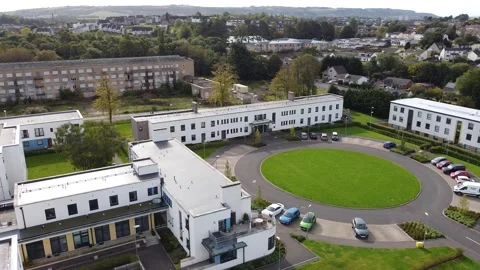 Circling Around Modern UK Residential Area with Communal Area and Parked Cars Stock Footage 254583653