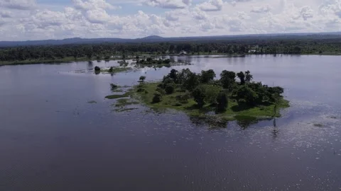 Circling around view of small island in lake Stock Footage 329933351