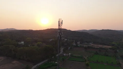 Circling drone shot of a telecom tower in rural India Stock Footage 305259503